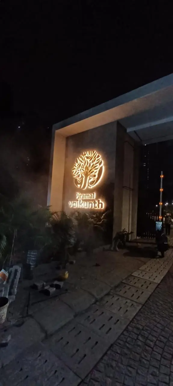 Illuminated Piramal Vaikunth entrance identity at night
