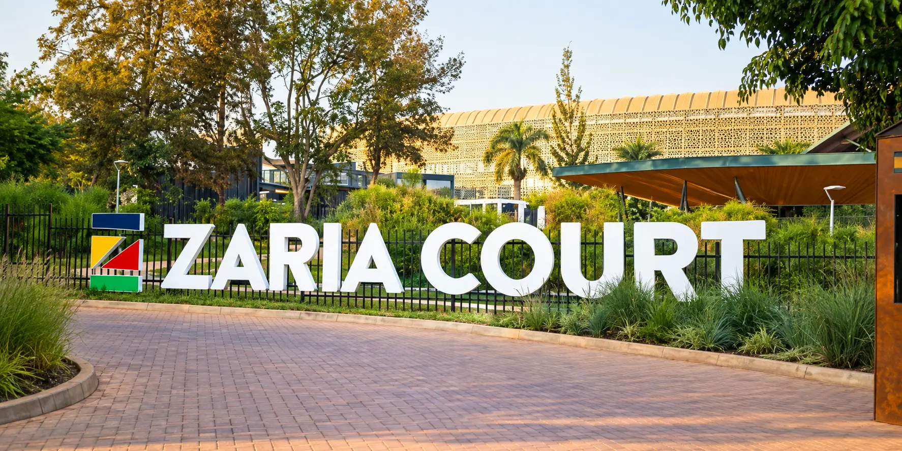 Zaria Court entrance monument identity by day